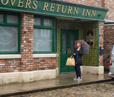 Jenny looks forlornly at the Rovers on Corrie