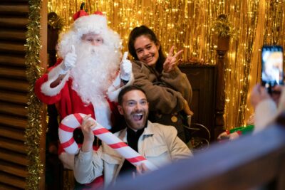 Dean at Santa's grotto dressed as Santa on EastEnders