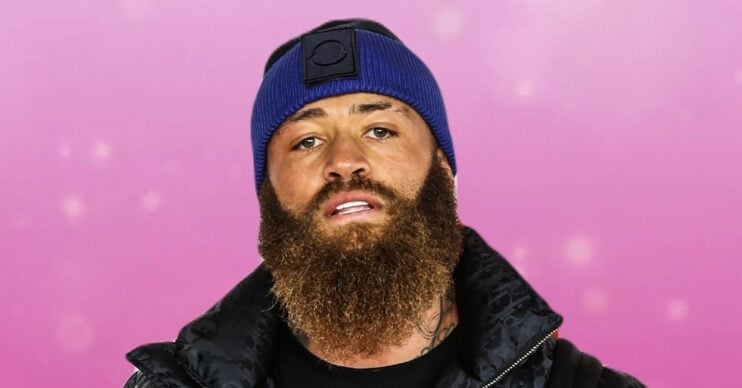 Ashley Cain in front of a pink background