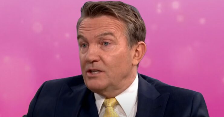 The Chase host Bradley Walsh in front of pink background