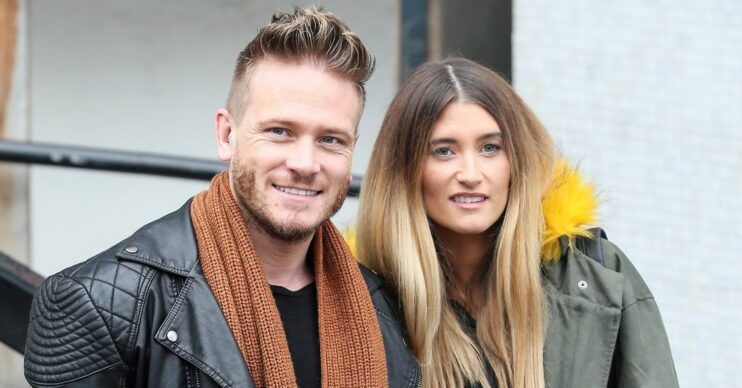 Charley Webb and Matthew Wolfenden smile at ITV studios