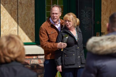 Coronation Street's Stephen is holding Jenny with a broken glass bottle outside of the Rovers