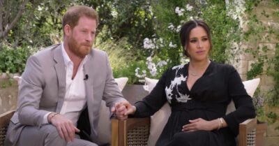 Meghan and Harry hold hands during the Oprah interview