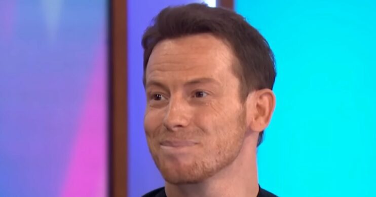 Joe Swash smiles