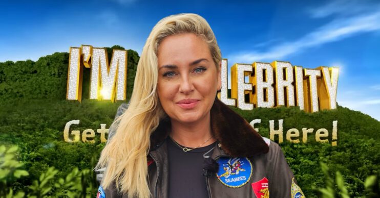 Josie Gibson standing in front of the I'm a Celebrity logo