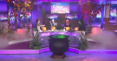 The Loose Women dressed up as witches, with a cauldron in the middle of the set