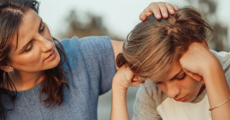 Woman comforting boy