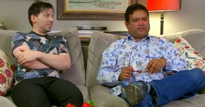 Paul Sinha and husband Oliver Levy sit on the sofa for Celebrity Gogglebox
