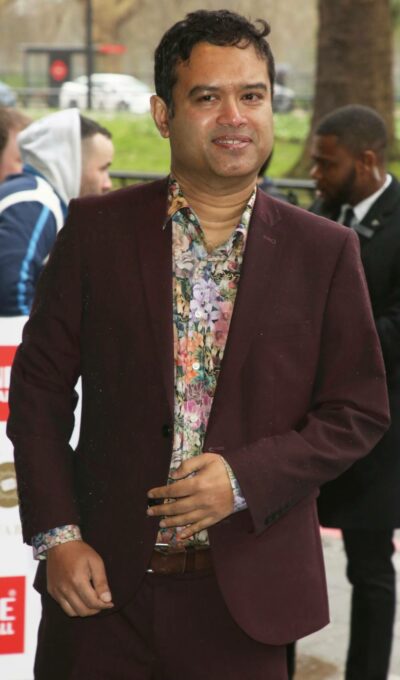 Paul Sinha smiles