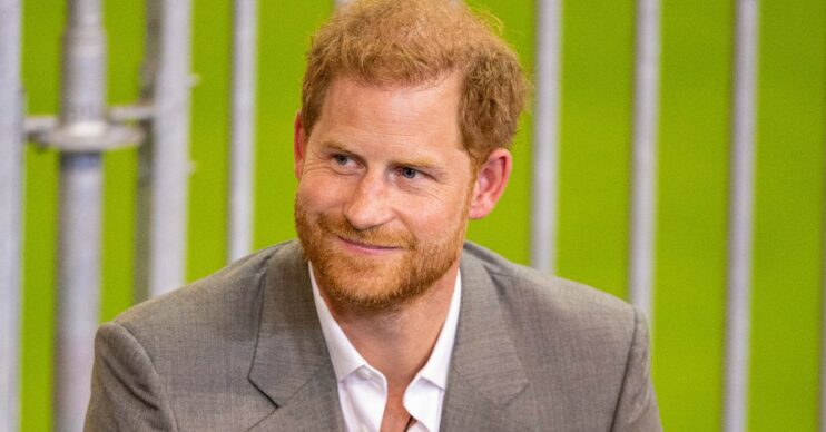 Prince Harry smiling as he talks to press at the Invictus Games 2023 press event