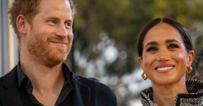 Prince Harry and Meghan Markle both smile