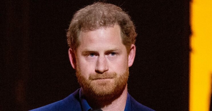 Prince Harry looks glum