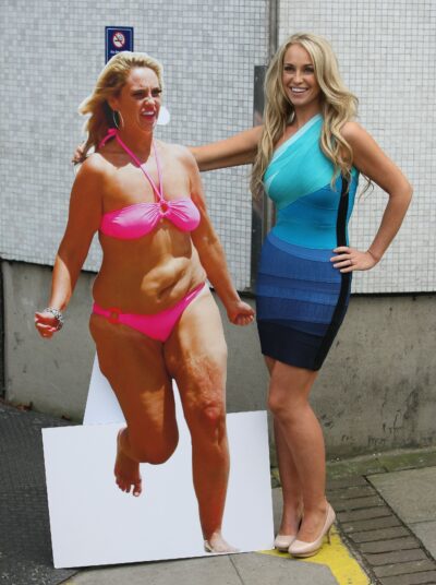 Josie Gibson pictured next to a cardboard cut out of herself after her weight loss