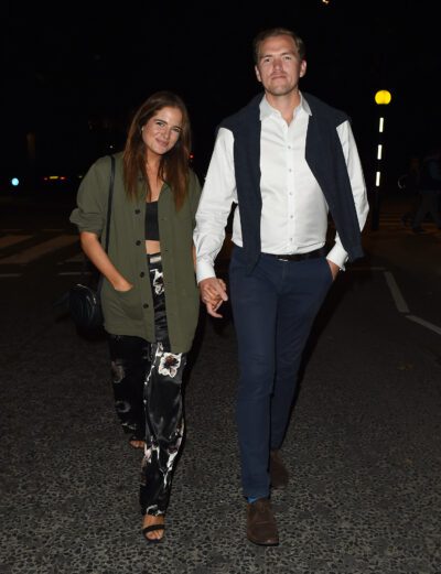 Binky Felstead and husband Max smiling holding hands