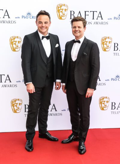 Ant McPartlin and Declan Donnelly smiling in suits at the BAFTAs