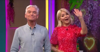 Phillip Schofield lifts his chin, Holly Willoughby waves