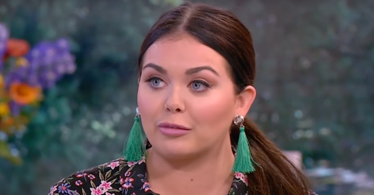 Scarlett Moffatt with her hair up and dangly green earrings
