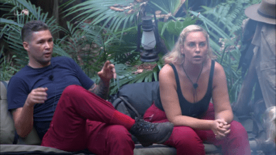 Tony Bellew looking annoyed and Josie Gibson looking shocked on I'm A Celebrity